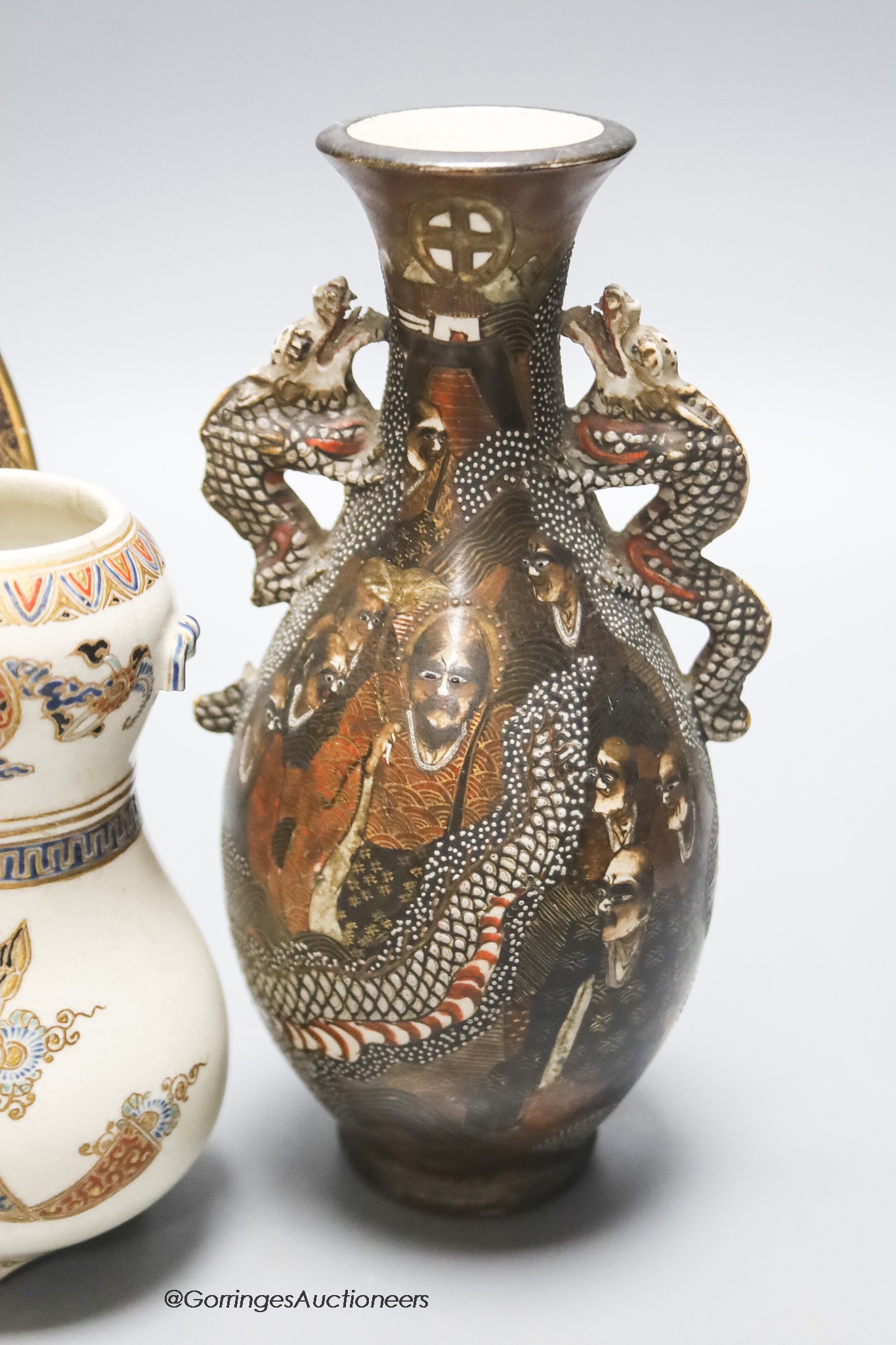 Two Japanese Meiji satsuma vases and a dish, largest 19cm